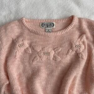 Pink floral knit top with pearl details, has shoulder pads but can be cut out